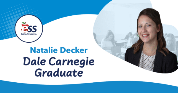 Portrait of Natalie Decker smiling, with a background of people in a classroom setting. The image includes the ESS logo with the tagline "Every day counts." and the text “Natalie Decker Dale Carnegie Graduate.